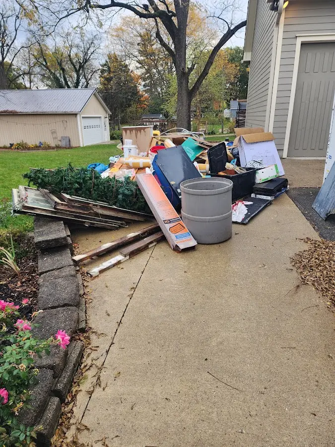 Dumpster being loaded with debris for 30 Yard Dumpster Rental in Brandenburg
